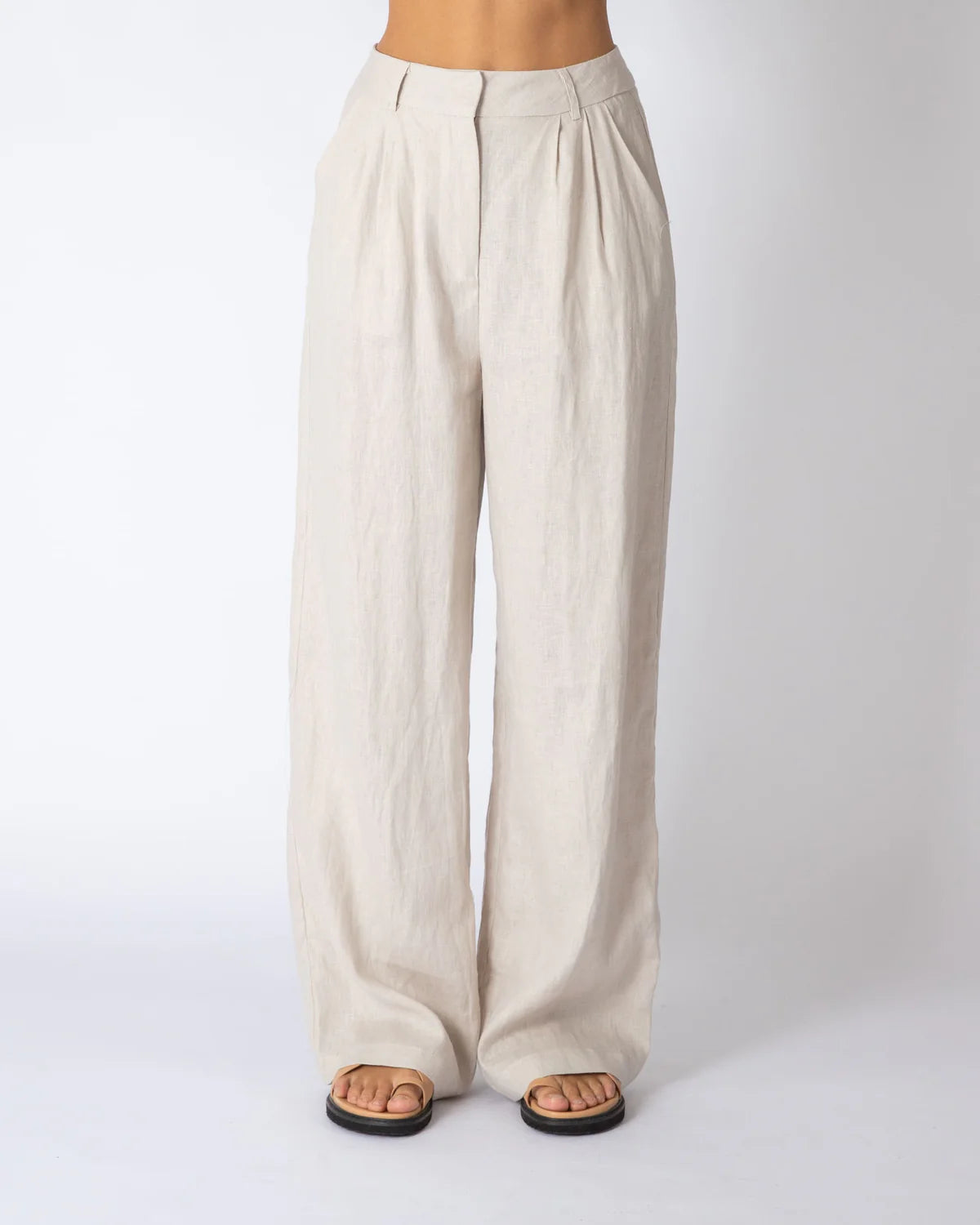 Beige wide-leg pants on a white background