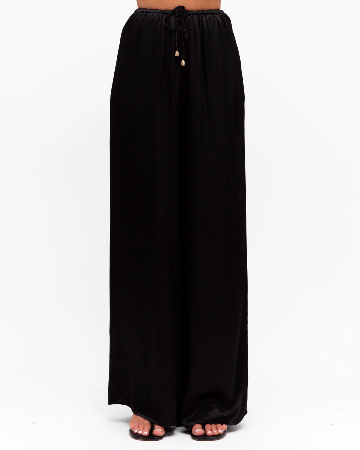 Black wide-leg pants on a white background